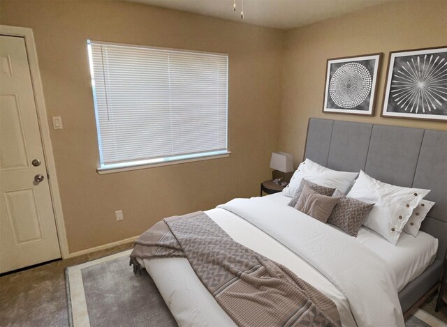 carpeted home office with ceiling fan and a textured ceiling