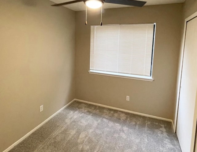 spare room with carpet, ceiling fan, and a healthy amount of sunlight