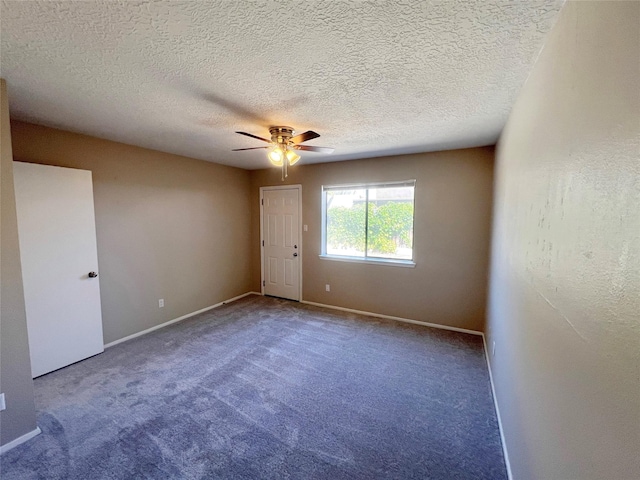 unfurnished room featuring carpet flooring, a textured ceiling, and ceiling fan