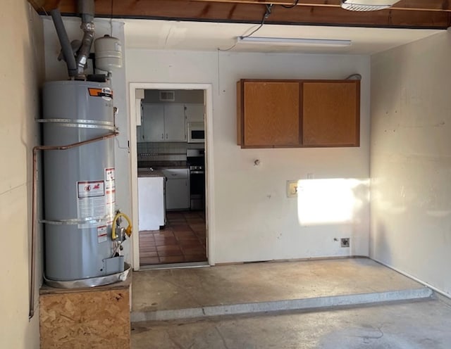 basement with strapped water heater