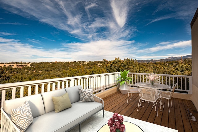 wooden terrace featuring outdoor lounge area