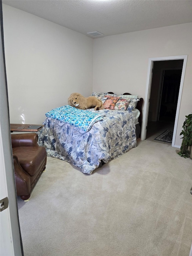 bedroom featuring light carpet