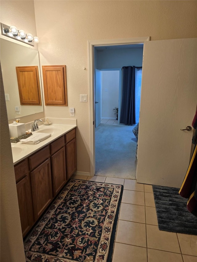 bathroom with tile patterned flooring and vanity