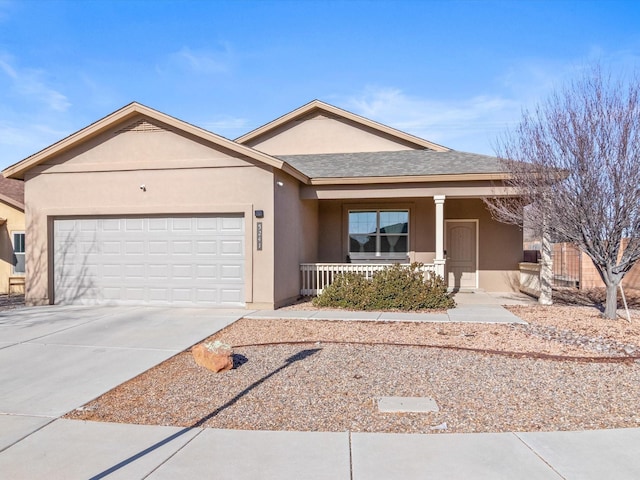 single story home with covered porch and a garage