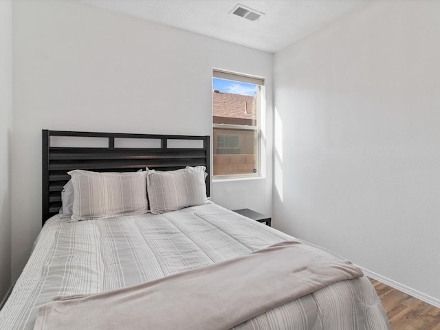 bedroom featuring hardwood / wood-style floors