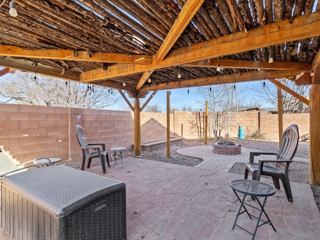 view of patio / terrace featuring cooling unit and a fire pit