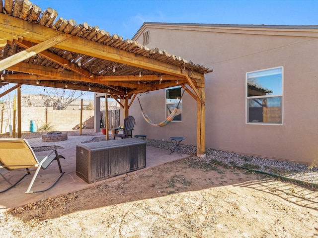 view of patio with a fire pit