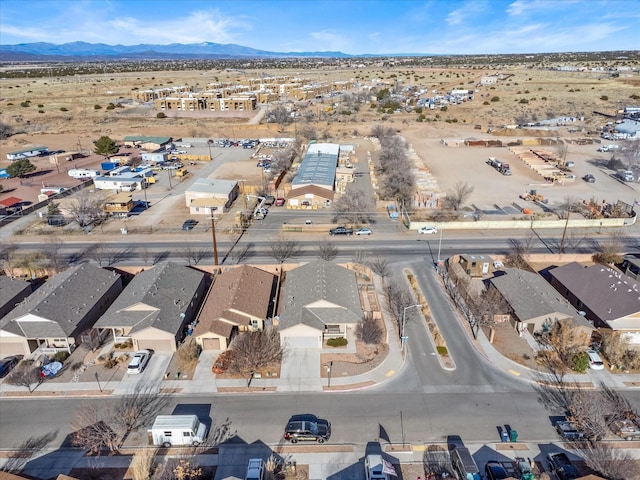 birds eye view of property featuring a mountain view