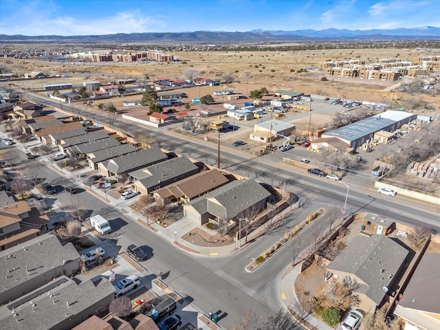 birds eye view of property with a mountain view