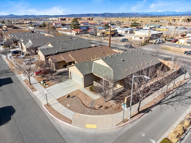 birds eye view of property featuring a mountain view