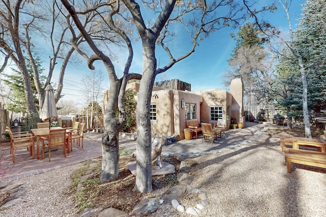 605 Abeyta St, Santa Fe, NM 87505 - view of front facade with a patio