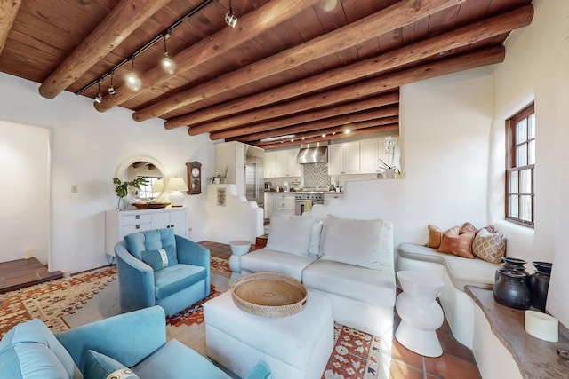 605 Abeyta St, Santa Fe, NM 87505 - living room featuring beam ceiling, tile patterned floors, rail lighting, and wood ceiling
