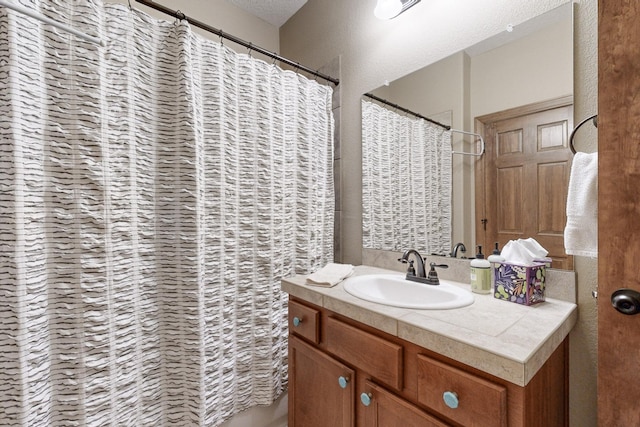 bathroom featuring vanity and a shower with curtain