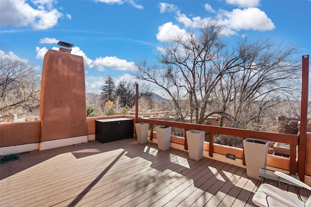 wooden deck with a mountain view