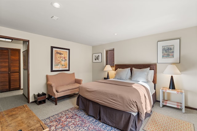 bedroom with light colored carpet