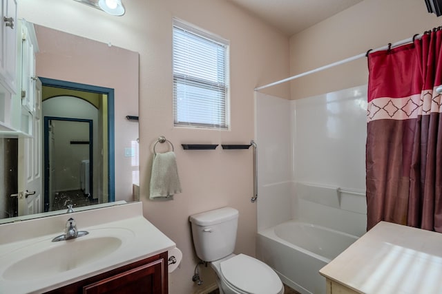 full bathroom with vanity, shower / bath combo, and toilet