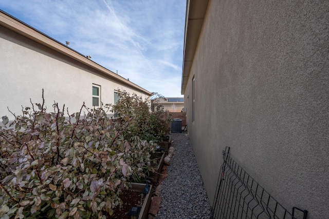 view of side of property with cooling unit