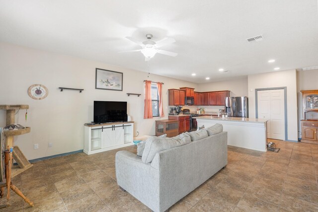 living room with sink and ceiling fan