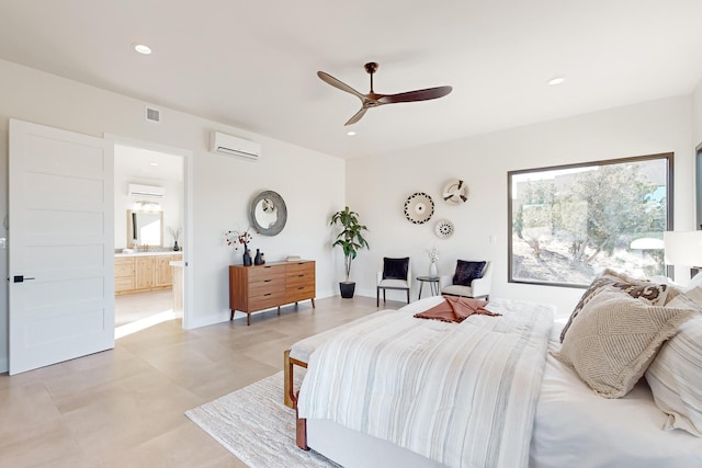 bedroom with a wall mounted AC, ceiling fan, and ensuite bath