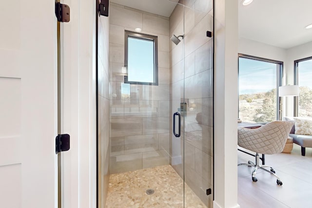 bathroom featuring an enclosed shower