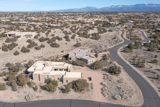 birds eye view of property featuring a mountain view