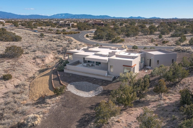 drone / aerial view featuring a mountain view