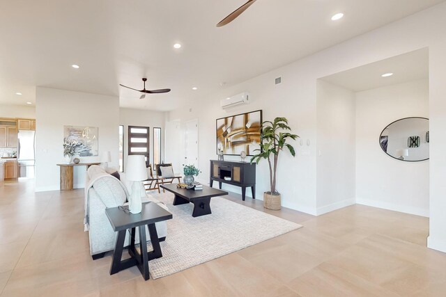 living room featuring ceiling fan and a wall mounted AC