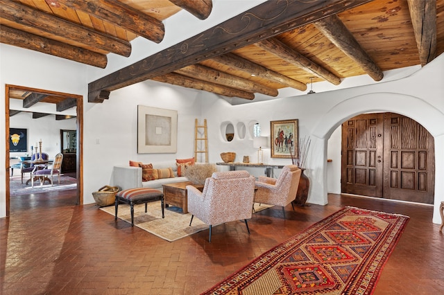 living room with beamed ceiling and wooden ceiling