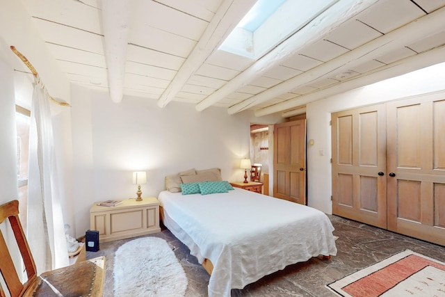 bedroom with wood ceiling and beamed ceiling