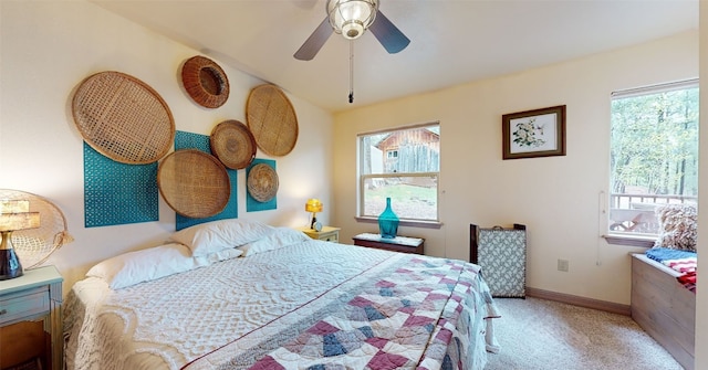 bedroom featuring ceiling fan and light carpet