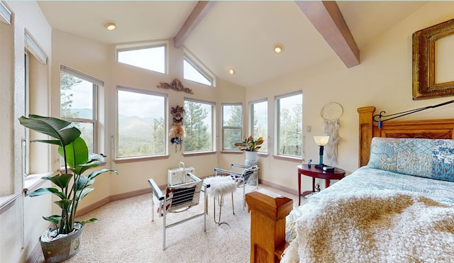 carpeted bedroom featuring lofted ceiling with beams