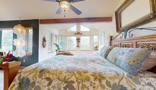 bedroom featuring multiple windows, ceiling fan, and lofted ceiling with beams