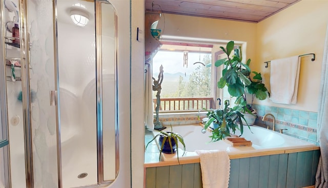 bathroom featuring wooden ceiling and shower with separate bathtub