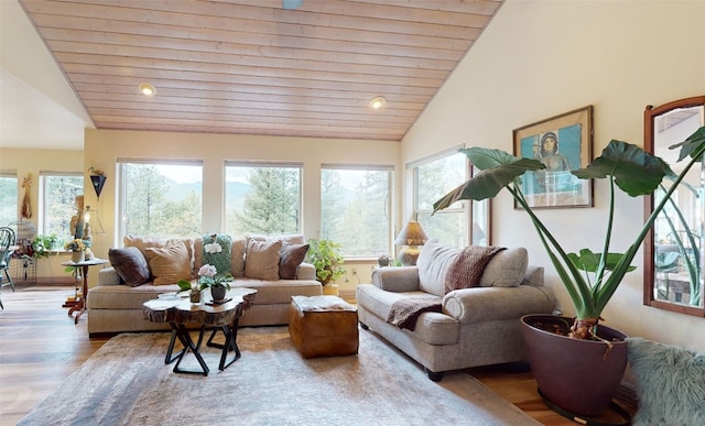 sunroom featuring plenty of natural light, wooden ceiling, and vaulted ceiling