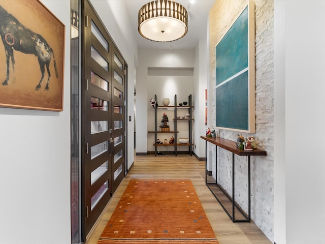 hall featuring french doors and wood-type flooring