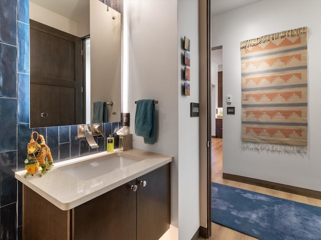 bathroom featuring hardwood / wood-style flooring and vanity