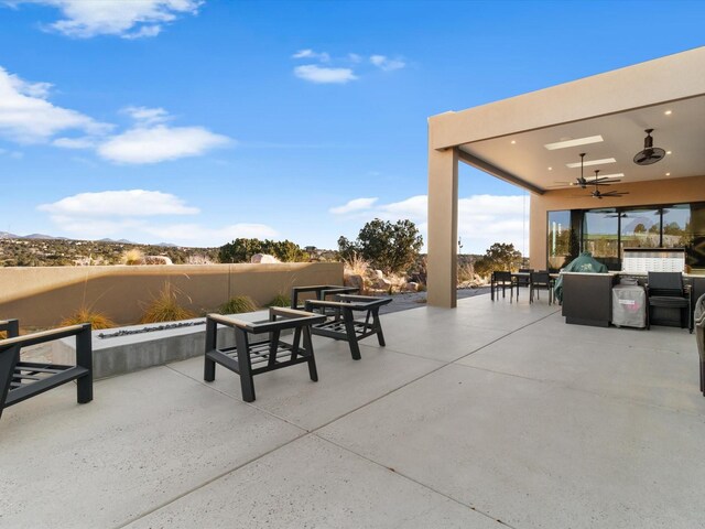 view of patio with ceiling fan