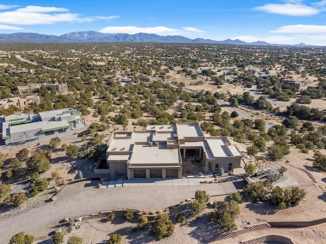 birds eye view of property featuring a mountain view