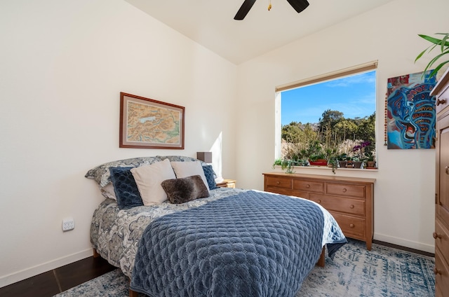 bedroom featuring ceiling fan and dark wood-type flooring