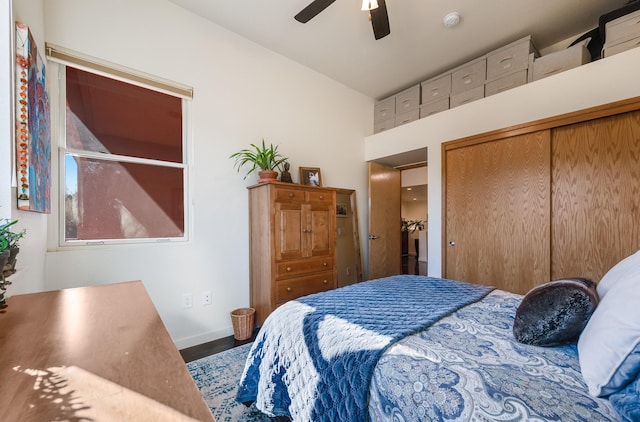 bedroom featuring hardwood / wood-style floors, a closet, and ceiling fan