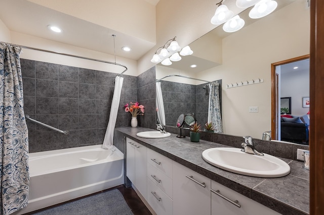 bathroom with vanity and shower / tub combo with curtain