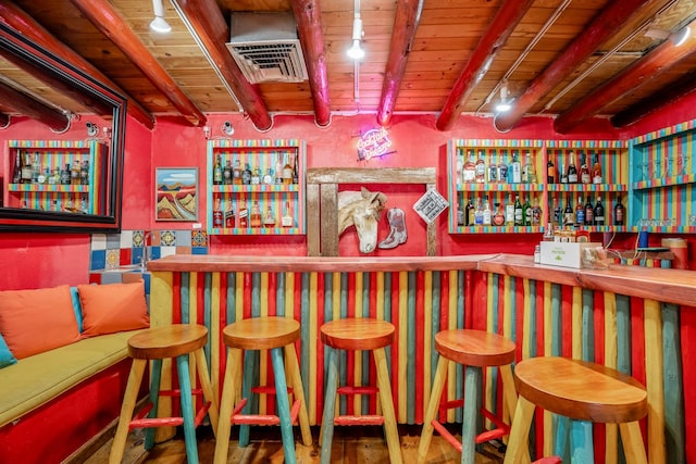 bar with beamed ceiling, wooden ceiling, and track lighting