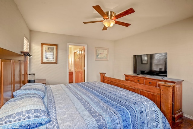 bedroom featuring hardwood / wood-style floors, ceiling fan, and connected bathroom