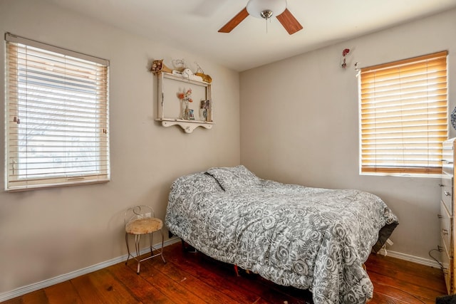 bedroom featuring ceiling fan and dark wood-type flooring