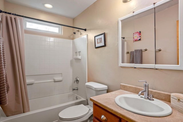 full bathroom featuring vanity, shower / bath combination with curtain, and toilet