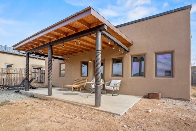 rear view of house featuring a patio