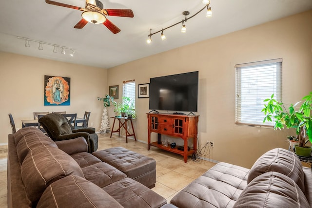 living room with ceiling fan and light tile patterned floors