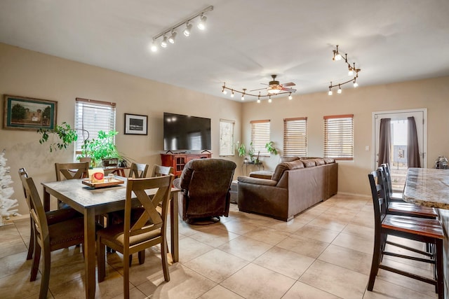 dining area with ceiling fan and light tile patterned floors