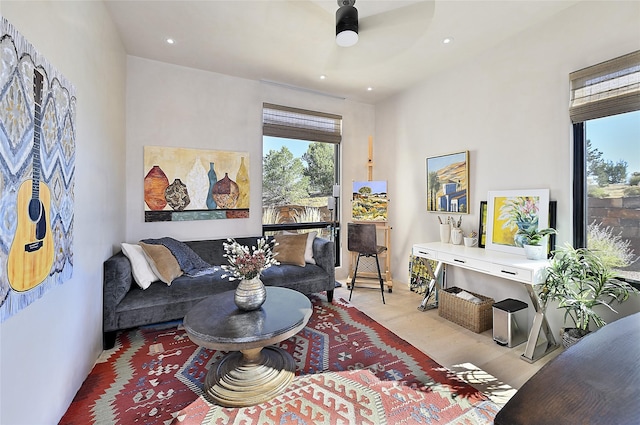 living room with ceiling fan, light wood-type flooring, and recessed lighting