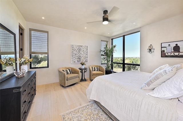 bedroom featuring light wood-style flooring, recessed lighting, and a ceiling fan